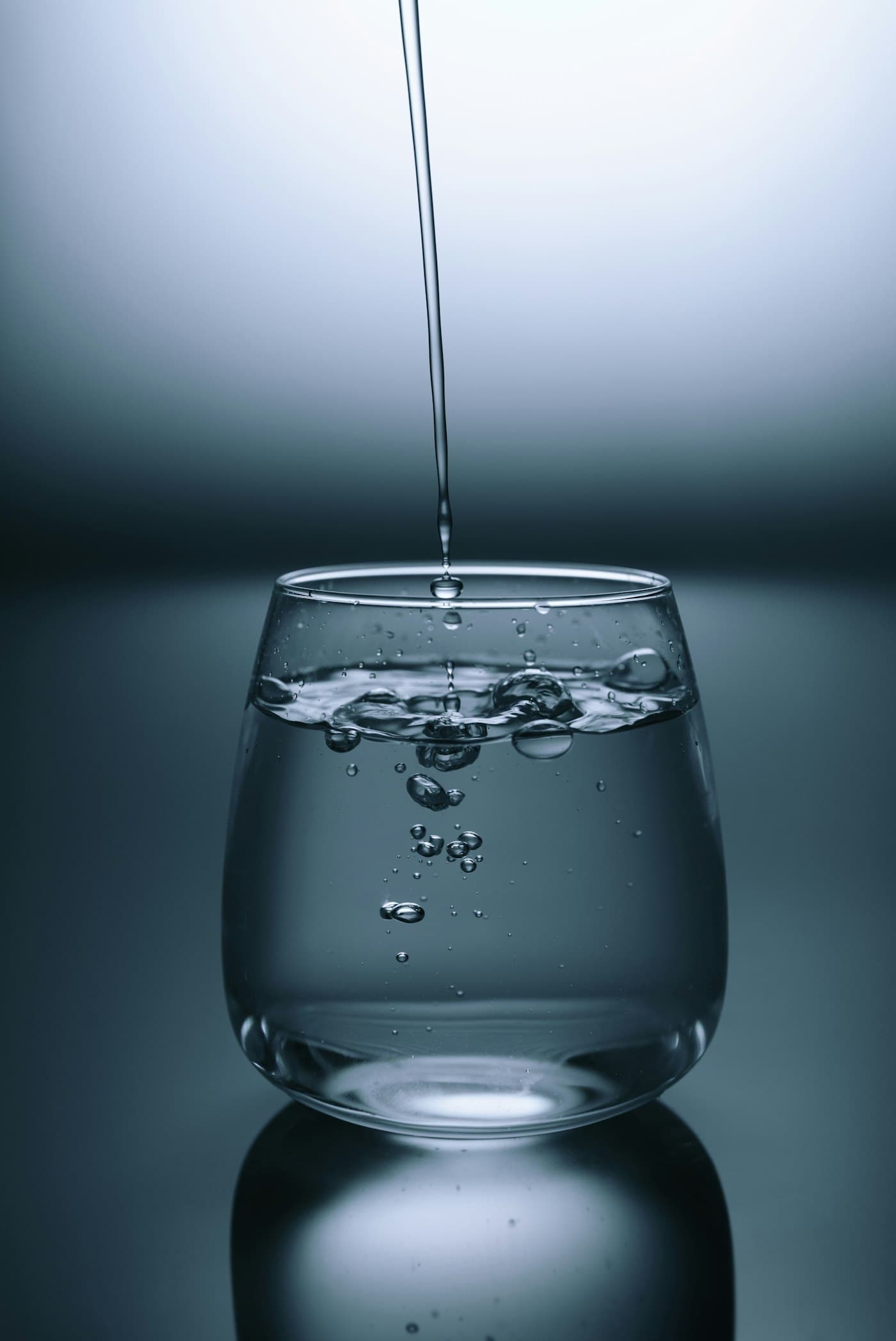 Clean water being poured, standing in for the Matasia water project
